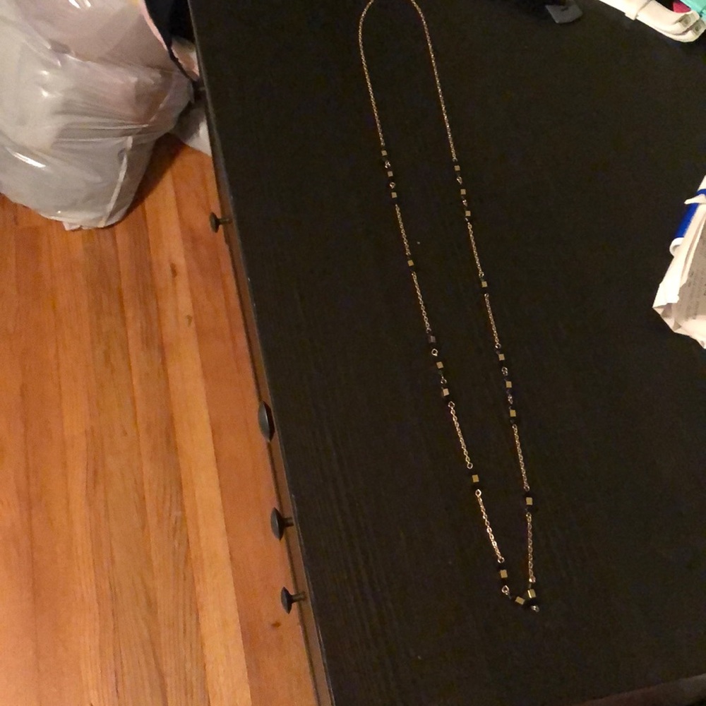 Excellent condition long black and gold necklace